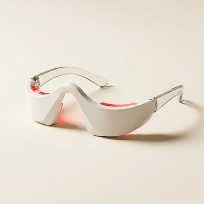 Las gafas de luz roja encendidas sobre fondo crema